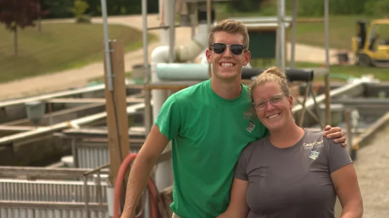 man and woman on fish farm