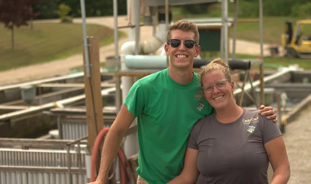 man and woman on fish farm