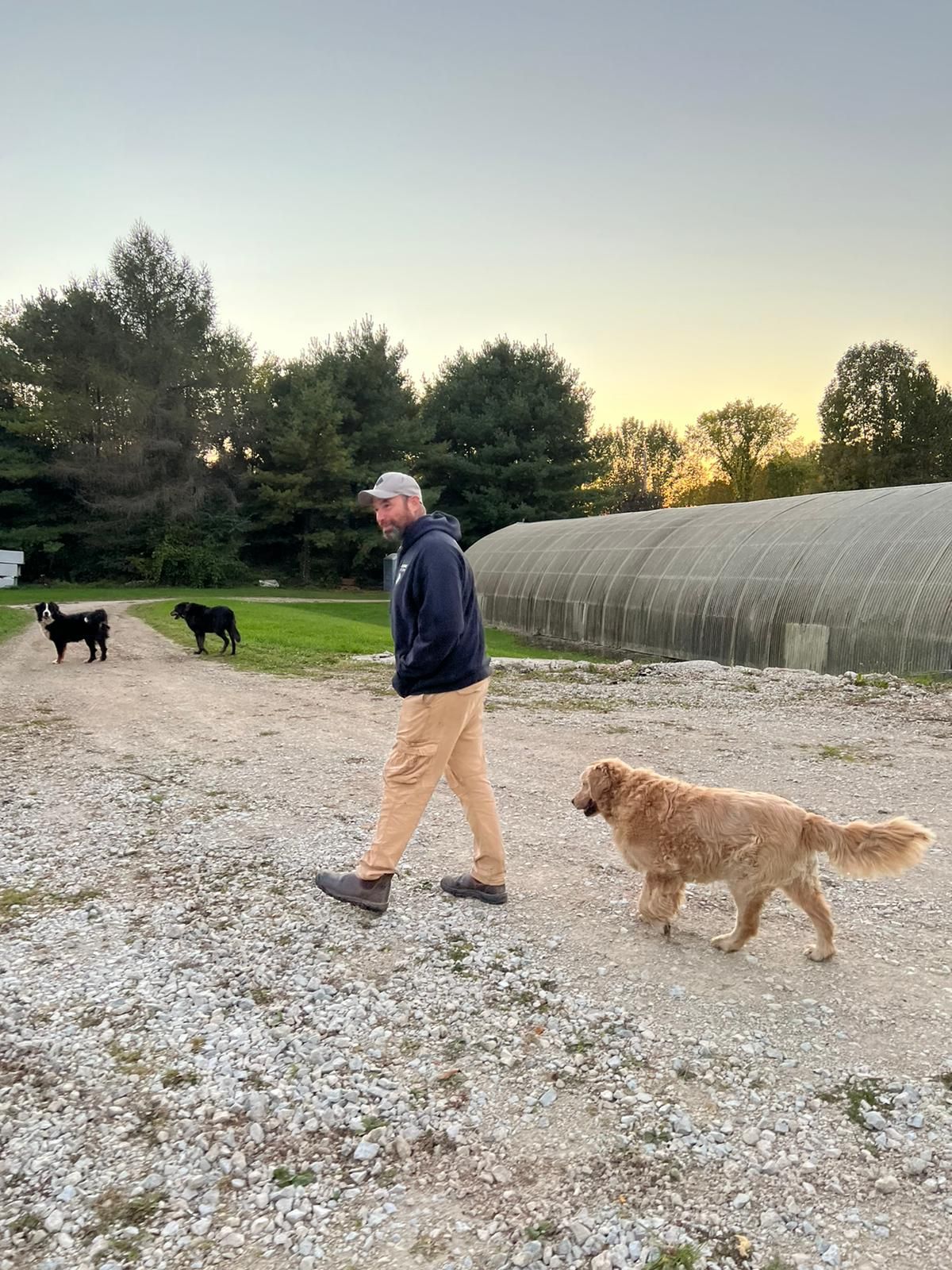 man with dog on farm