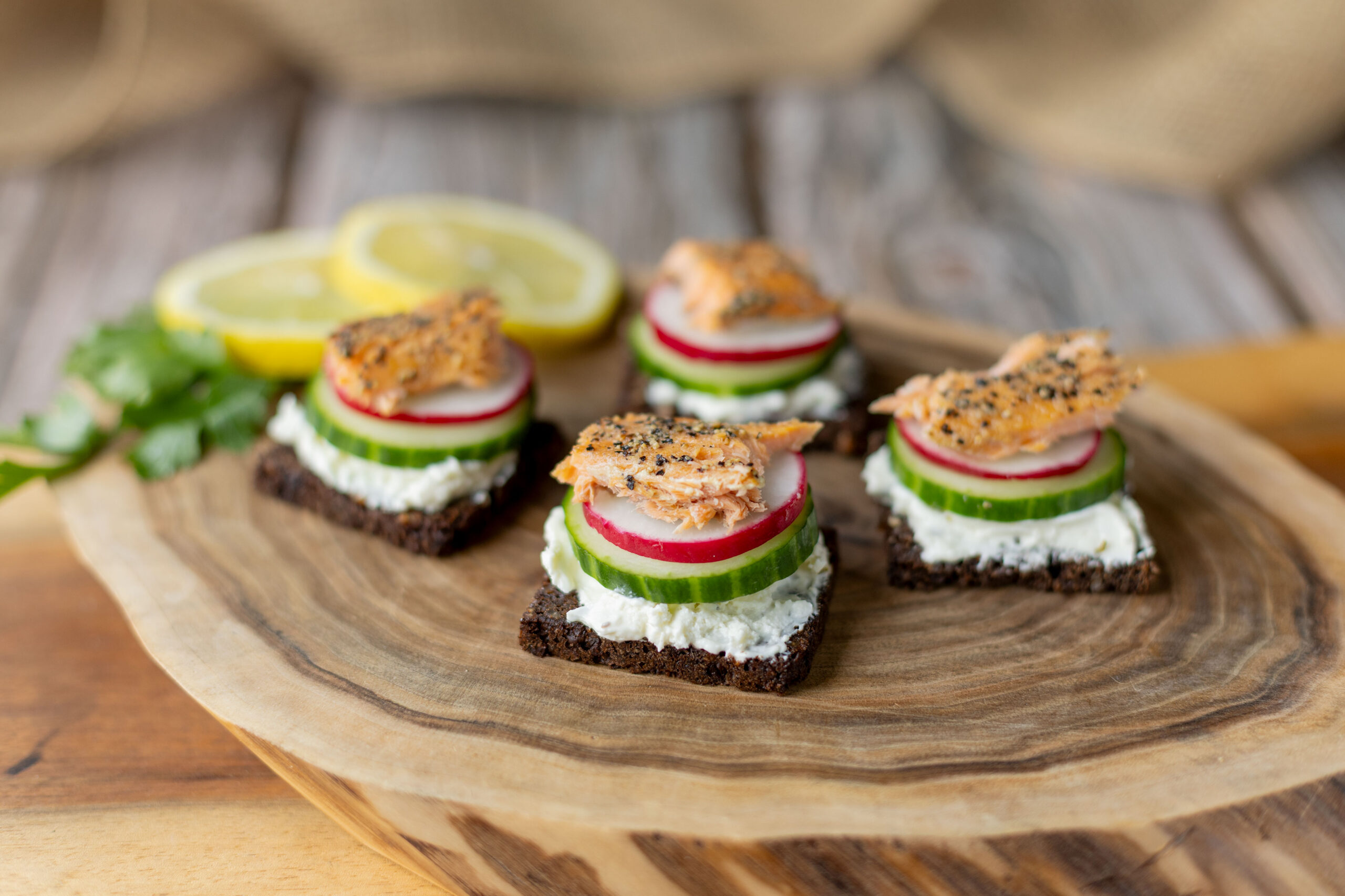 Lemon pepper hot smoked rainbow trout fillet on crackers