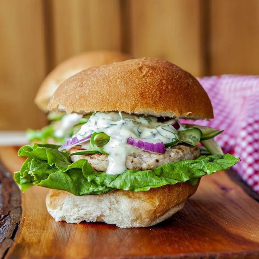 Pickerel walleye burger on wood board